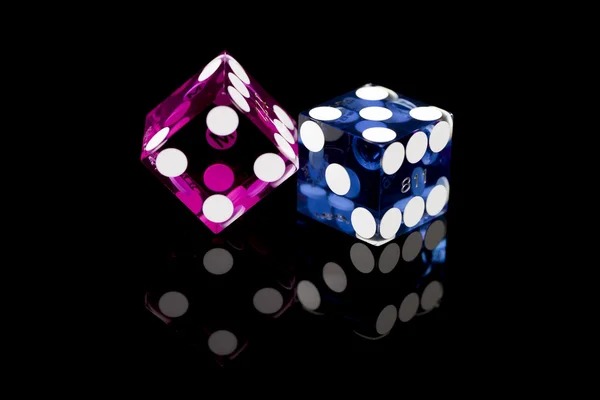 Mobile phone displaying live casino interface with dealer video and betting controls